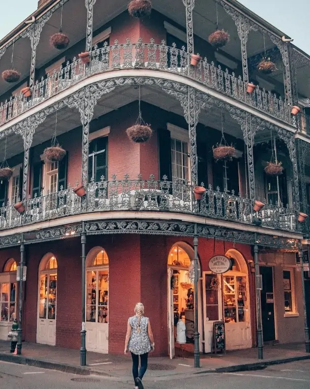 Red building with balconies in French Quarter in New Orleans that is popular in Instagram posts