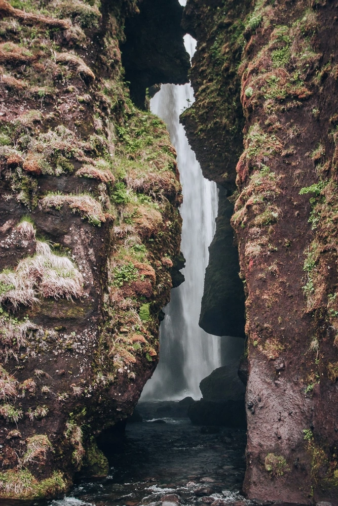 Looking into the canyon at Glujfrabui waterfall in southern Iceland. Find the top 5 waterfalls in Iceland that you don't want to miss on a Ring Road road trip. 