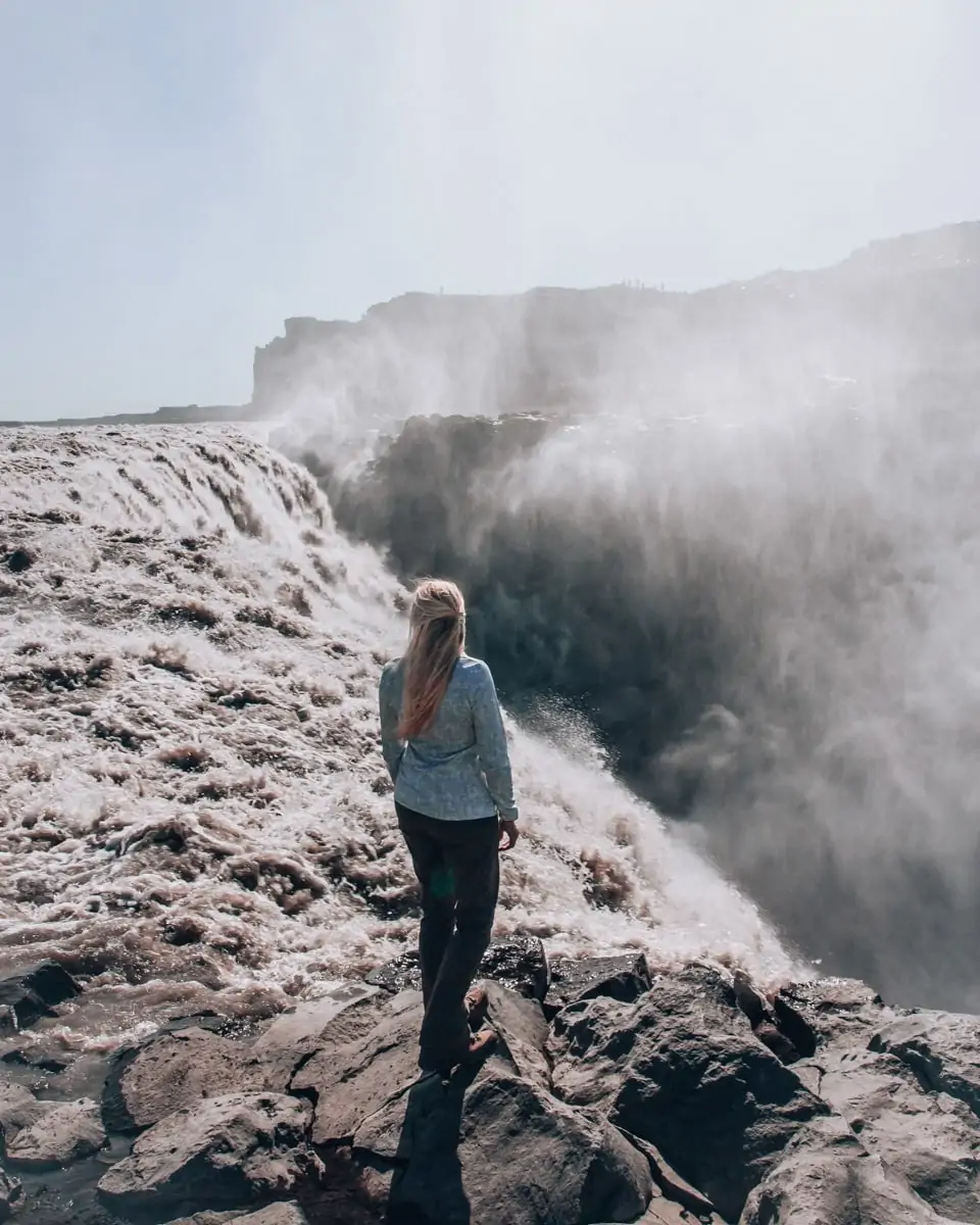 At Dettifoss in north eastern Iceland, you can stand right on the edge of the waterfall at the viewpoint on the east side. Get other useful Iceland travel tips with our full Iceland road trip itinerary.