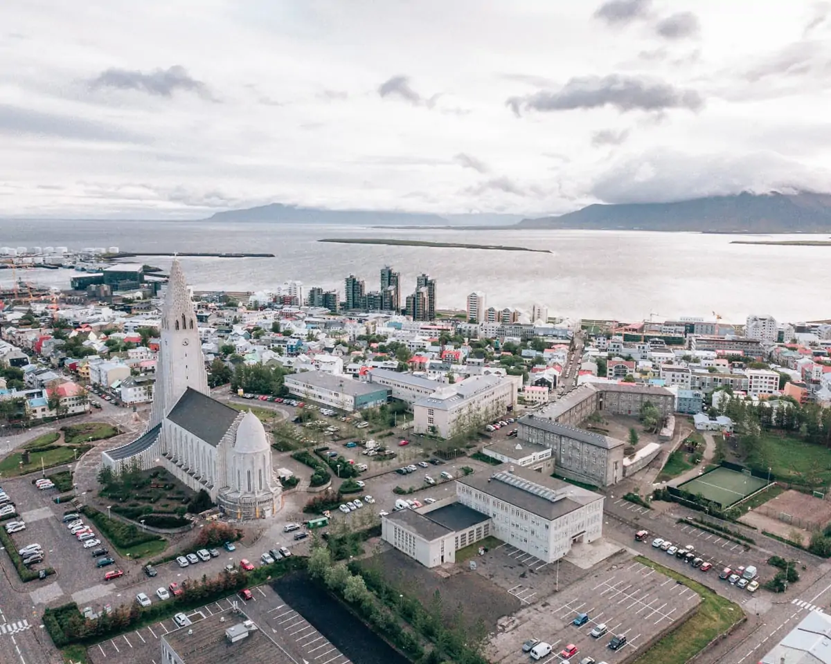 Drone shot of Reykjavik and Hallgrimskirkja from above. Check out our perfect 6 day itinerary for Ring Road in Iceland in summer!