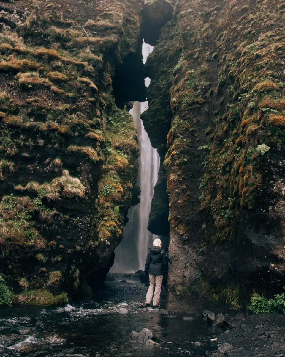 Looking into the depth of the canyon that houses Gljufrabui waterfall in southern Iceland. Get our full itinerary for a week in Iceland here!