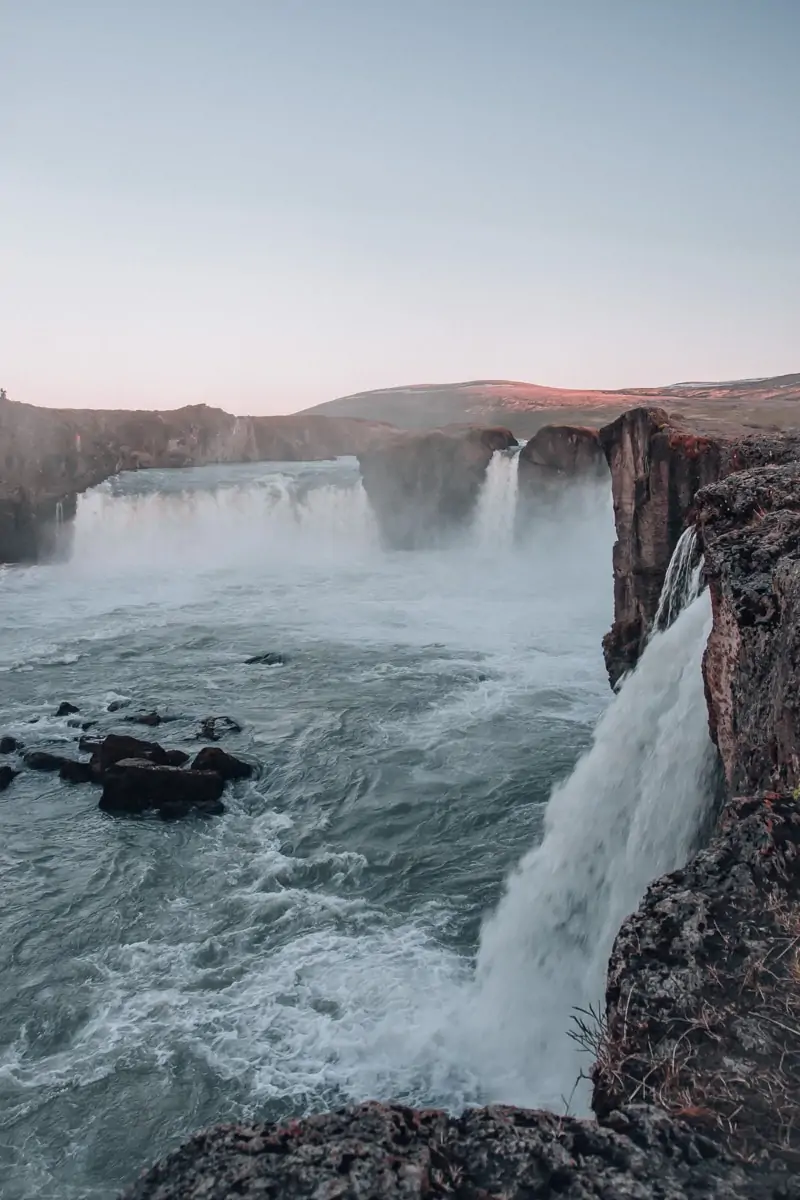Side view of Godafoss waterfall in Iceland in summer. Get the perfect guide to summer in Iceland here with a full itinerary for Ring Road.
