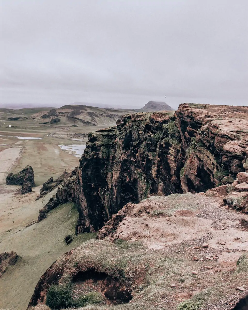 Cliffs at Dyrholaey in Iceland near Vik. Get all of our best Iceland travel tips with our full Iceland itinerary here.