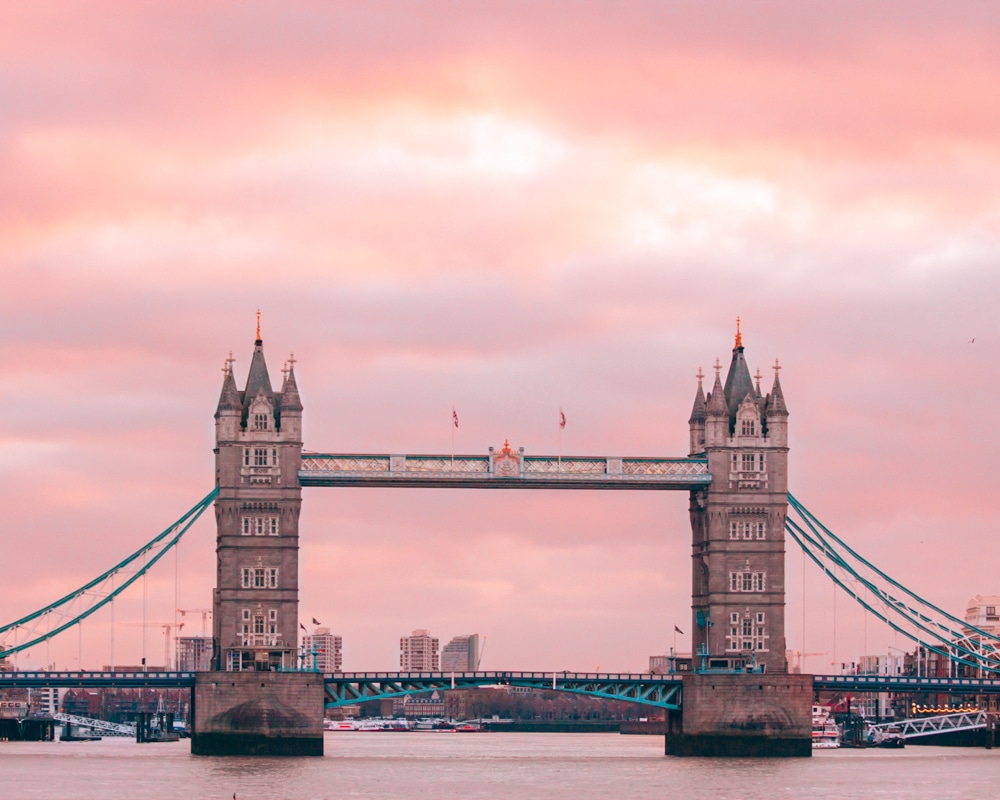 Tower Bridge in London is the perfect place to watch the sunrise before eating in the Coppa Club igloos.