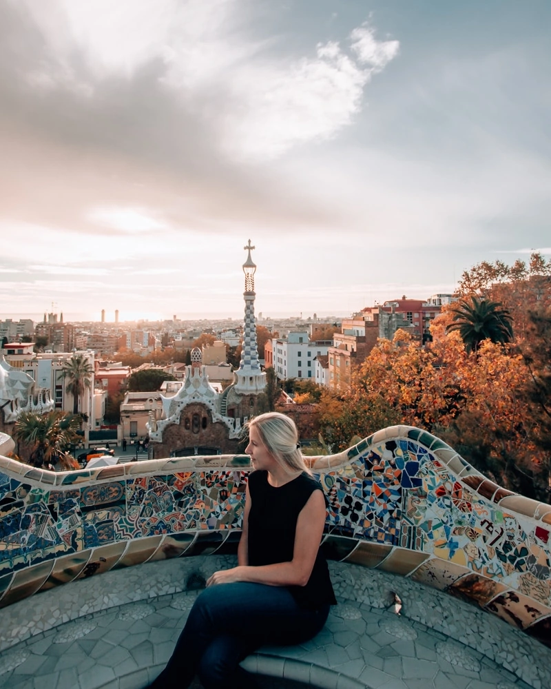 Sunrise view of Barcelona from Park Guell in Barcelona in the fall. Get a full travel guide to Barcelona including a 3 day itinerary with all the best photo spots here!