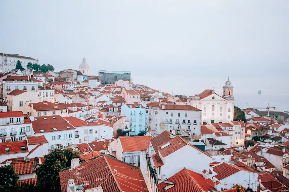 View of Lisbon from Alfama. Find the best places in Lisbon for Instagrammable photos and when to go to get them to yourself!