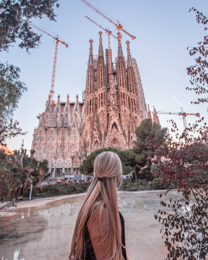 Sagrada Familia from the park across the street - one of the most famous Instagrammable places in Barcelona. Make sure to get our full guide to Barcelona here.