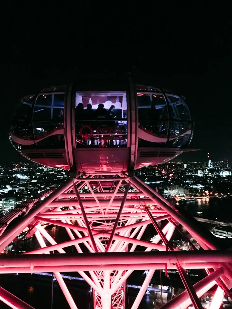 View from the London Eye at night. Find the perfect 3 day itinerary for London with Instagrammable places to see, places to eat, and places to stay.