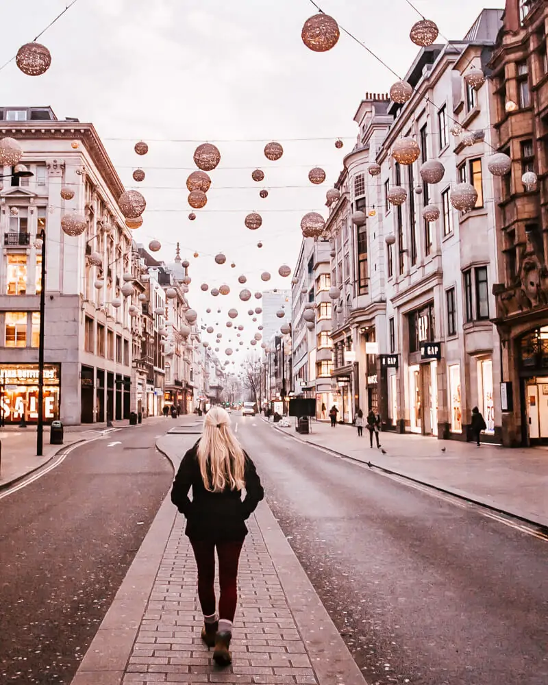Walking down the middle of Oxford Street at Christmas. Get a detailed guide to 3 days in London and all the best Instagram photo spots in London here.