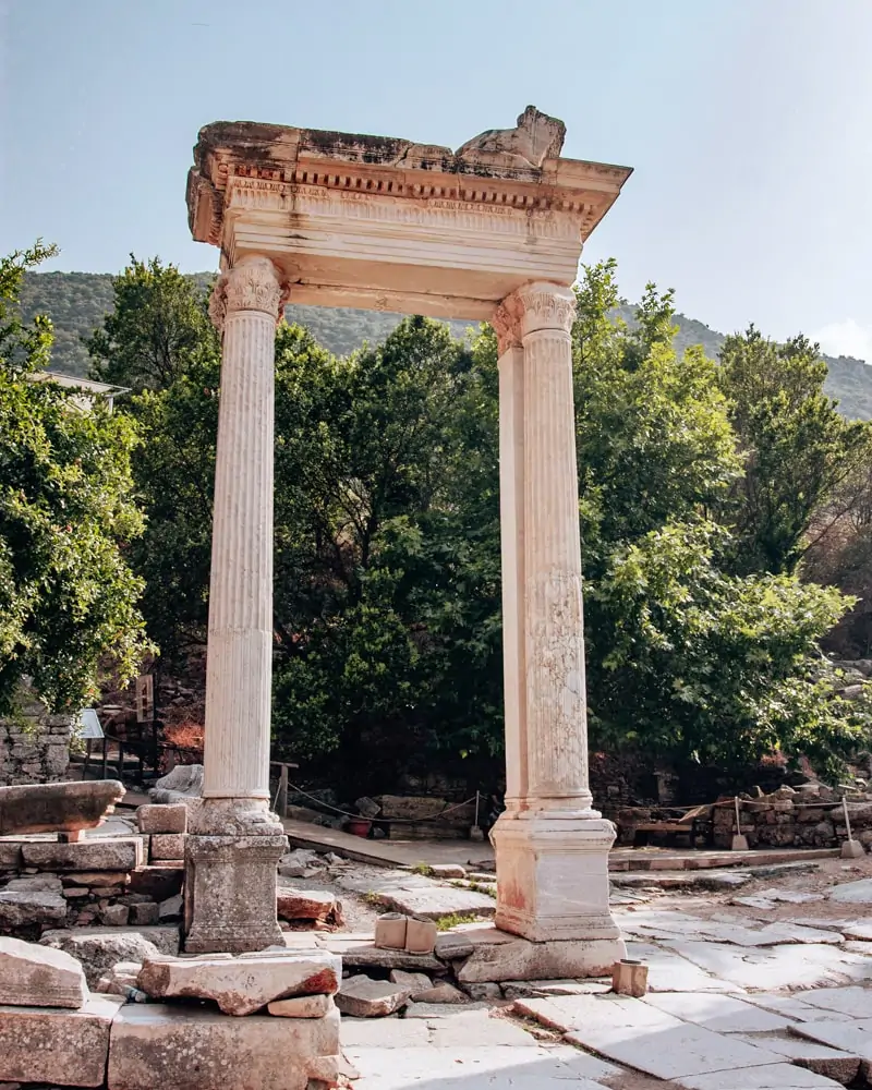 Two columns still standing in ancient Ephesus. Find a full one day itinerary with everything you need to know about visiting the ancient ruins of Ephesus in Turkey here.