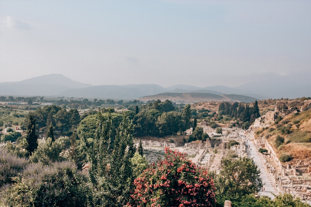 A view of ancient Ephesus and the surrounding areas from the Terrace Houses. Find a full one day itinerary with everything you need to know about visiting the ancient ruins of Ephesus in Turkey here.