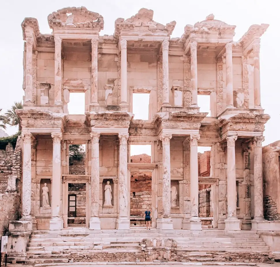 The Library of Celsus in ancient Ephesus. Find a full one day itinerary with everything you need to know about visiting the ancient ruins of Ephesus in Turkey here.