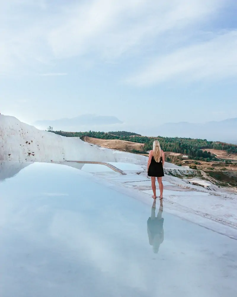 Enjoying the peace and quiet before the crowds arrive in Pamukkale. The Ultimate Guide to Visiting Pamukkale gives you all the information you need about what you can really expect, when to go, where to stay, and more.