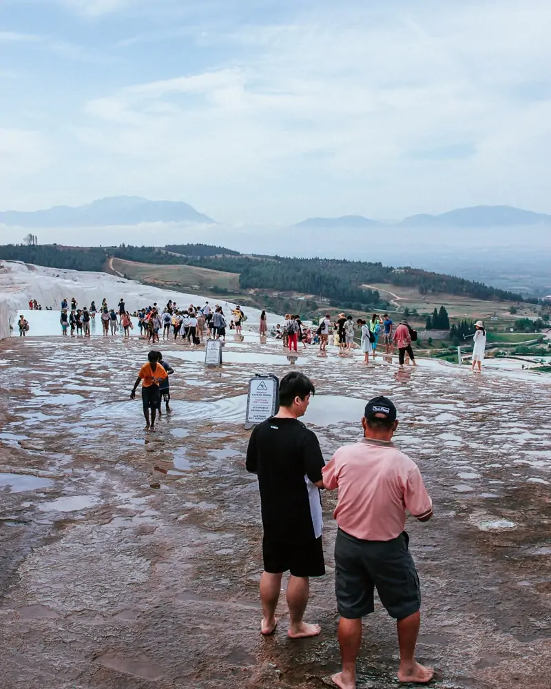 The tour groups arrive to Pamukkale in full force by 9 a.m. The Ultimate Guide to Visiting Pamukkale gives you all the information you need about what you can really expect, when to go, where to stay, and more.