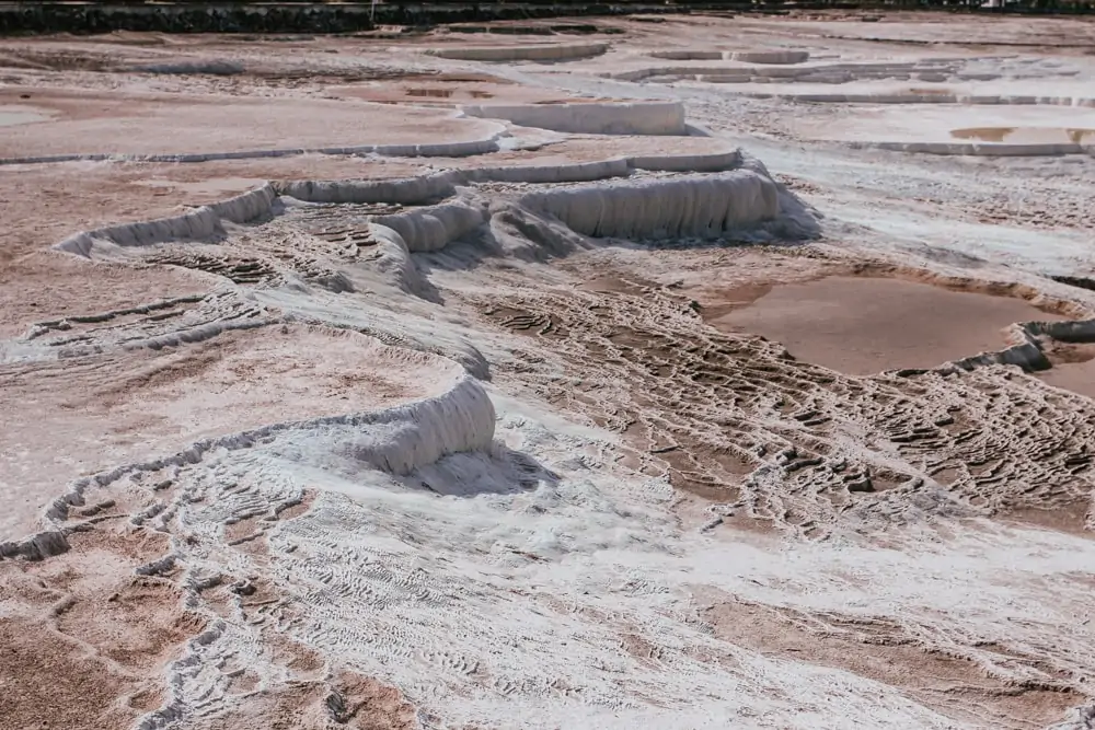 Many of Pamukkale's natural pools were damaged and are being restored. The Ultimate Guide to Visiting Pamukkale gives you all the information you need about what you can really expect, when to go, where to stay, and more.