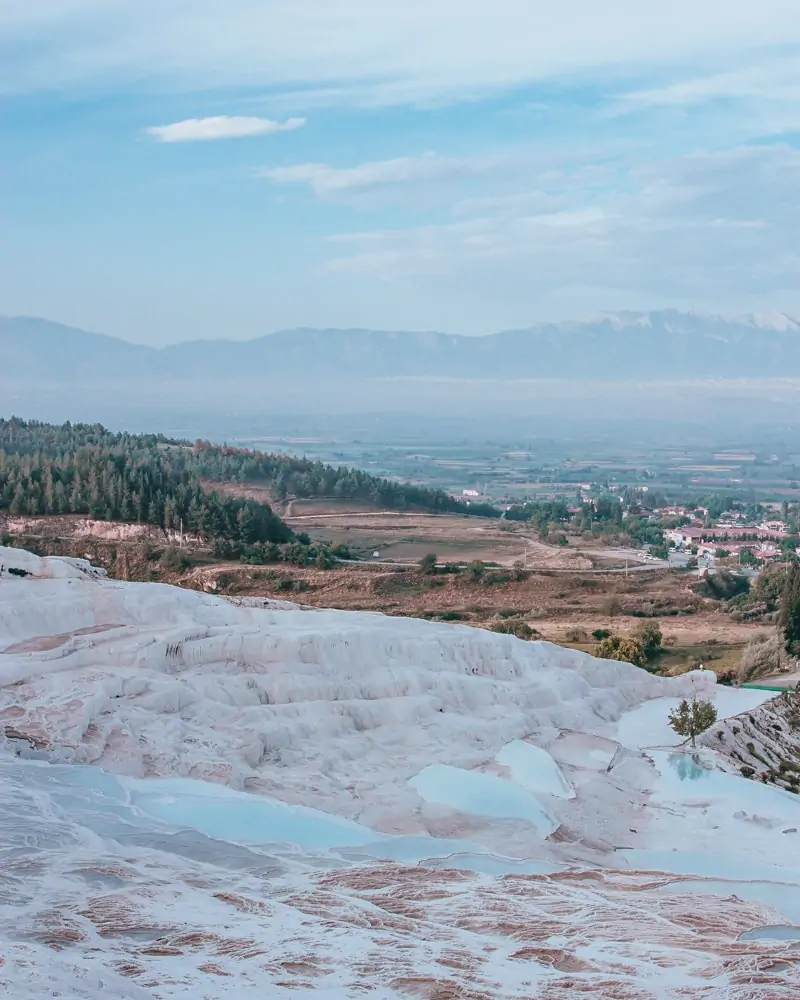 The natural and man-made pools that make up Pamukkale. The Ultimate Guide to Visiting Pamukkale gives you all the information you need about what you can really expect, when to go, where to stay, and more.