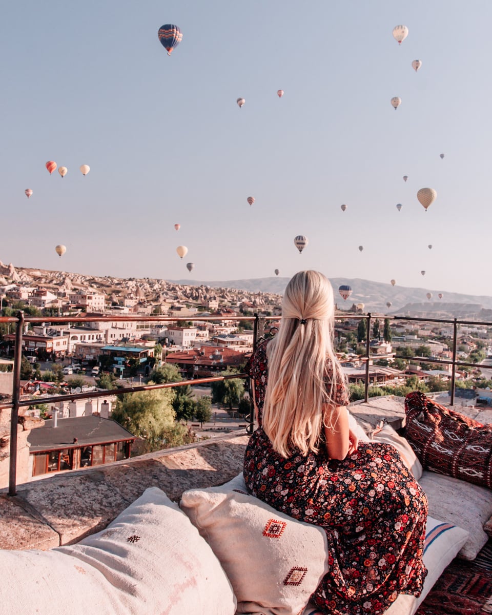 Watching the hot air balloons at sunrise in Cappadocia from Cappadocia Cave Suites.