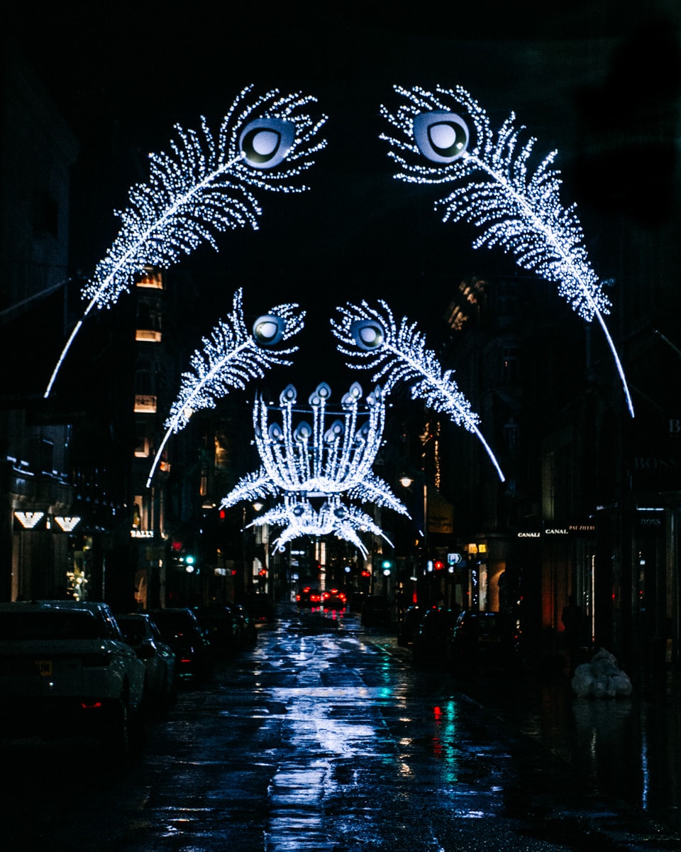 Peacock feathers made of Christmas lights arch over Bond Street at Christmas in London