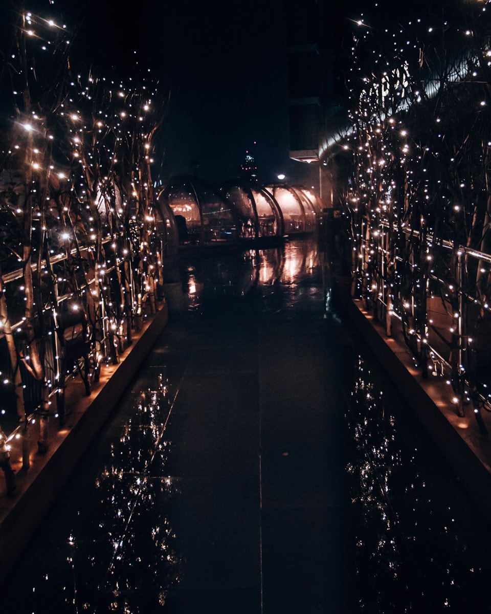 The walkway into the Coppa Club igloos at night