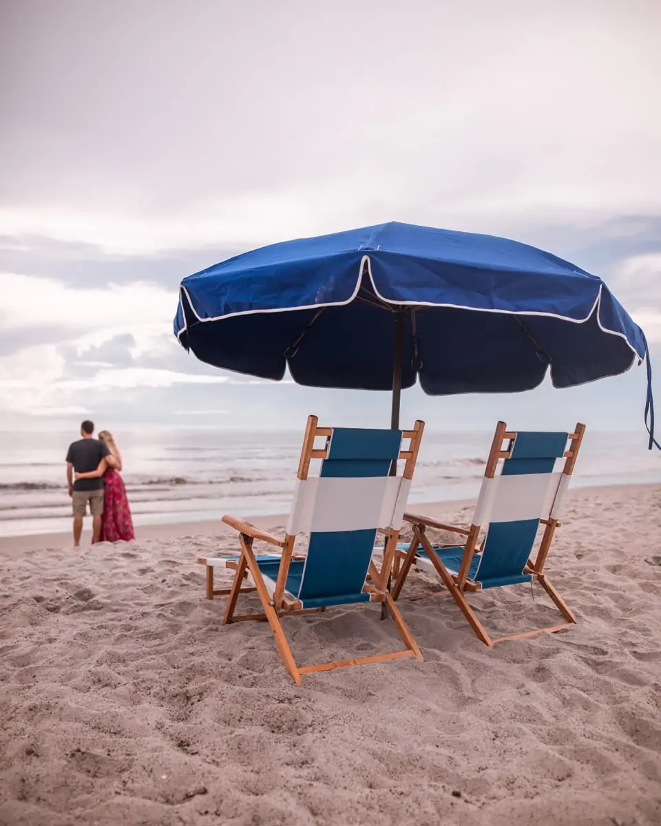 Watching the sunrise by the beach concierge umbrellas and lounge chairs at Cocoa Beach's Westgate Cocoa Beach Resort in Florida.