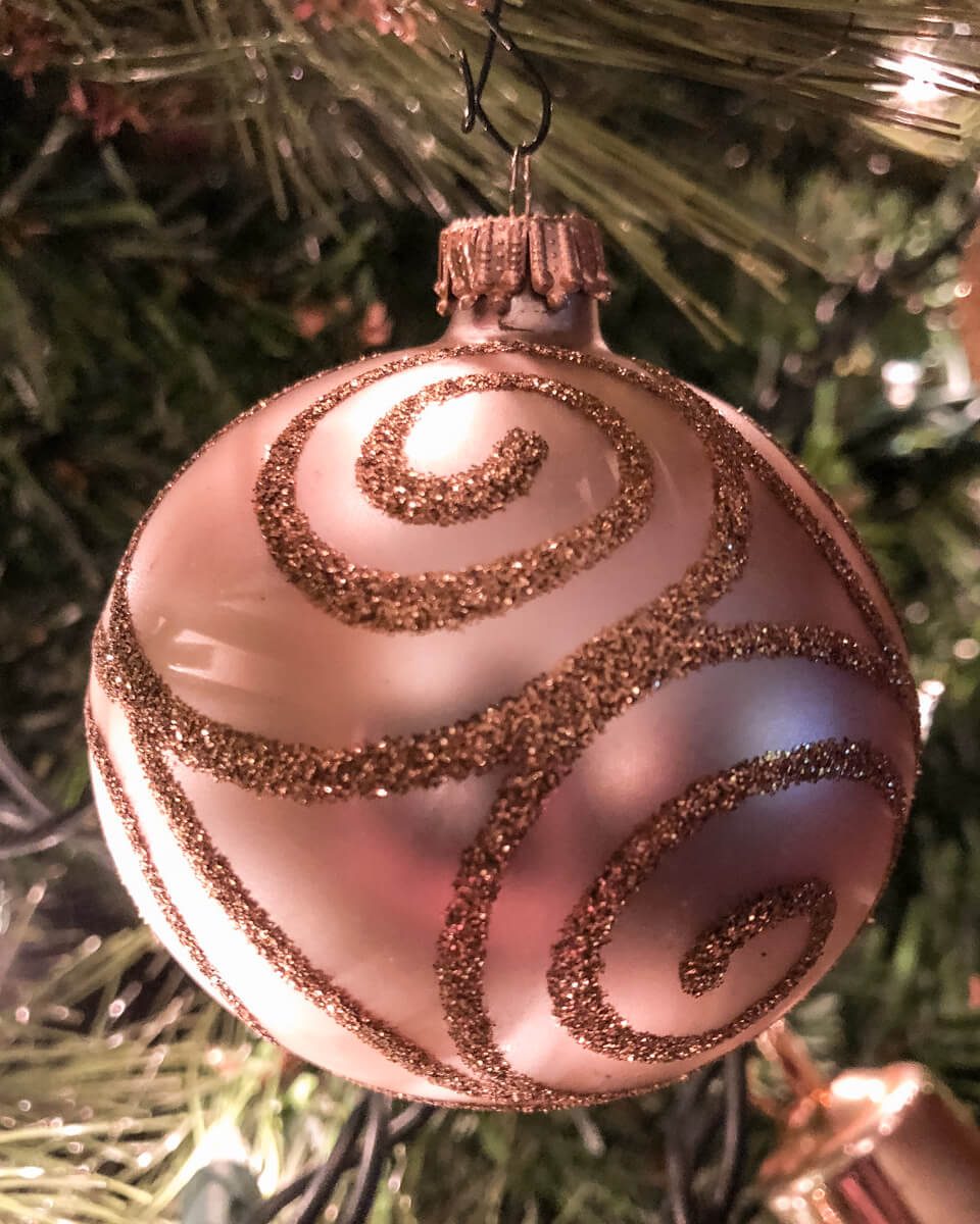 A Christmas ornament hangs on a Christmas tree in Orlando, Florida