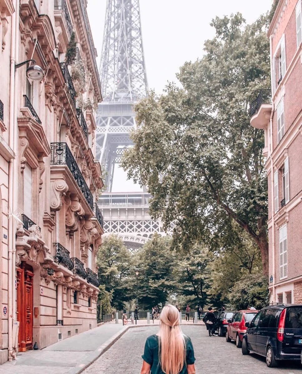 The view of the Eiffel Tower from Rue de l'Universite. Get the best photo spots for the Eiffel Tower and a guide to New Year's in Paris here.