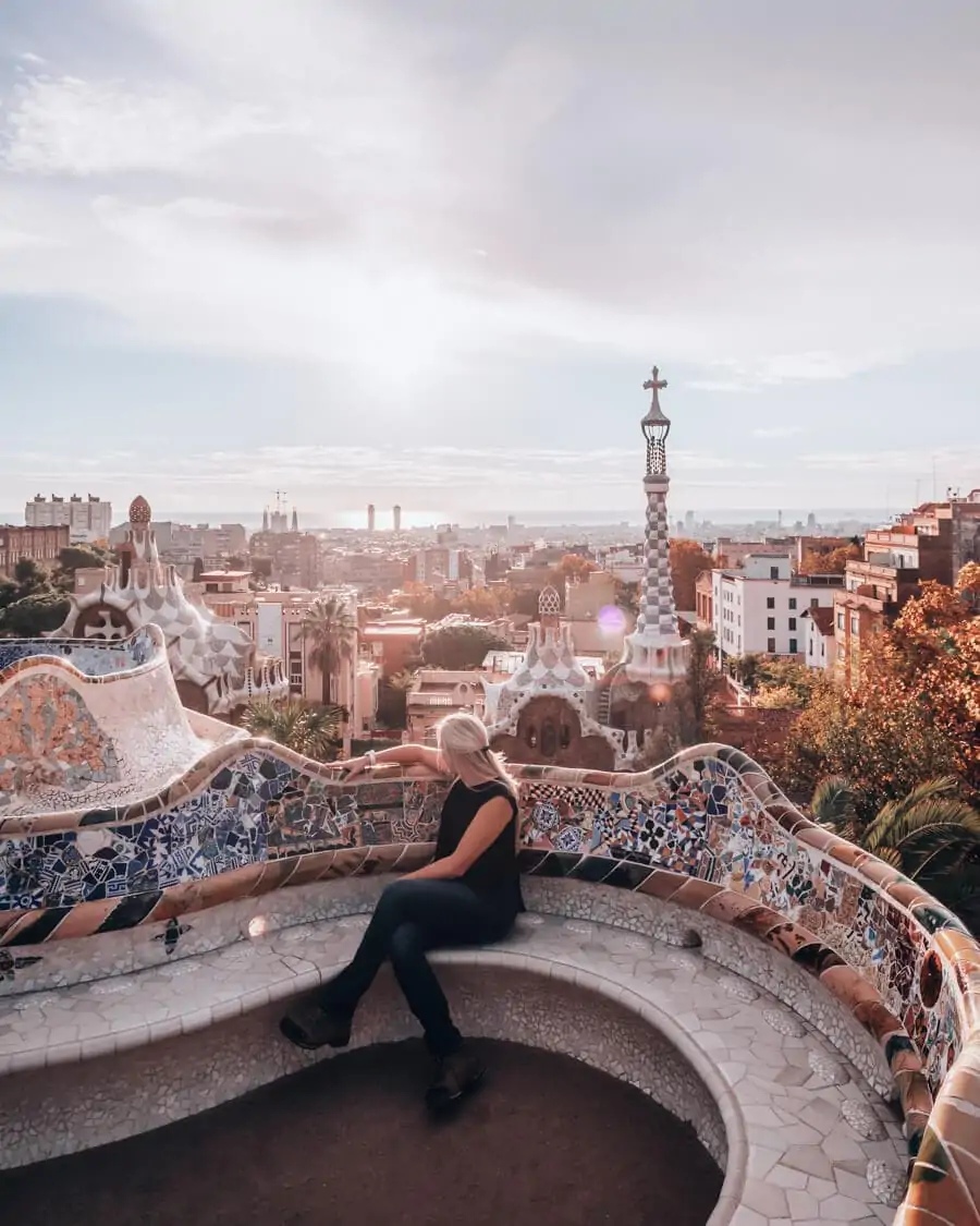 A woman looking out over Barcelona in the Greek Theater in Park Guell