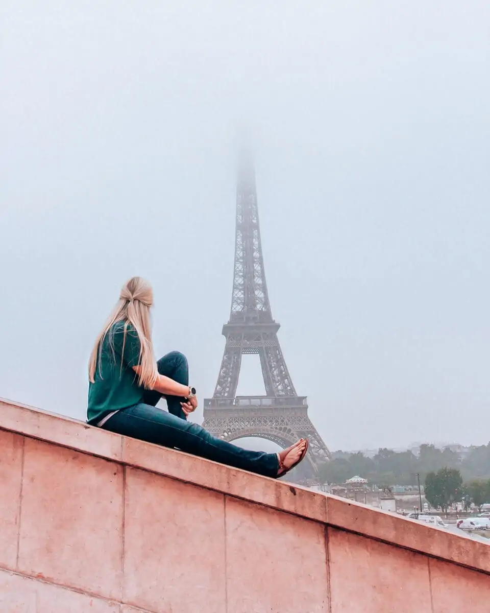 Woman at Trocadero at sunrise with the Eiffel Tower