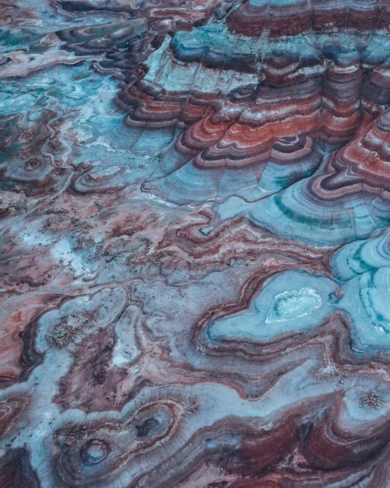 the reds and blues of the bentonite hills at blue hour