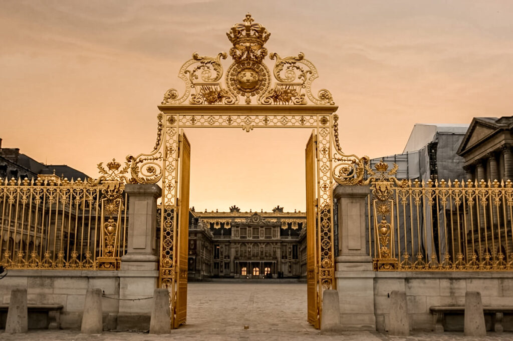 sunset at the gates to Versailles in Paris