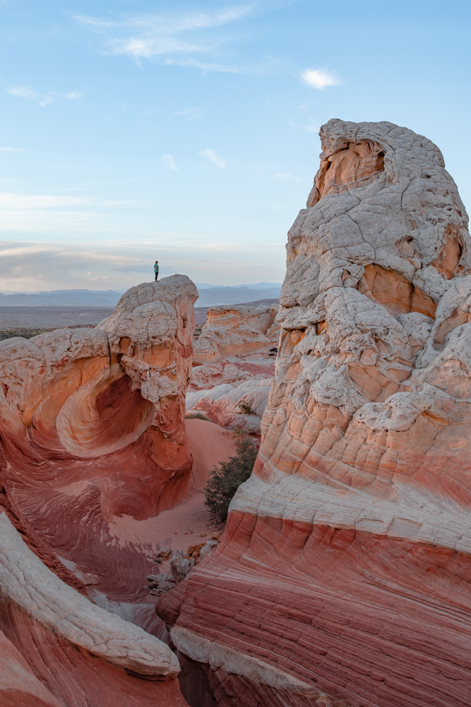 woman standing on one of the places like the wave arizona at white pocket