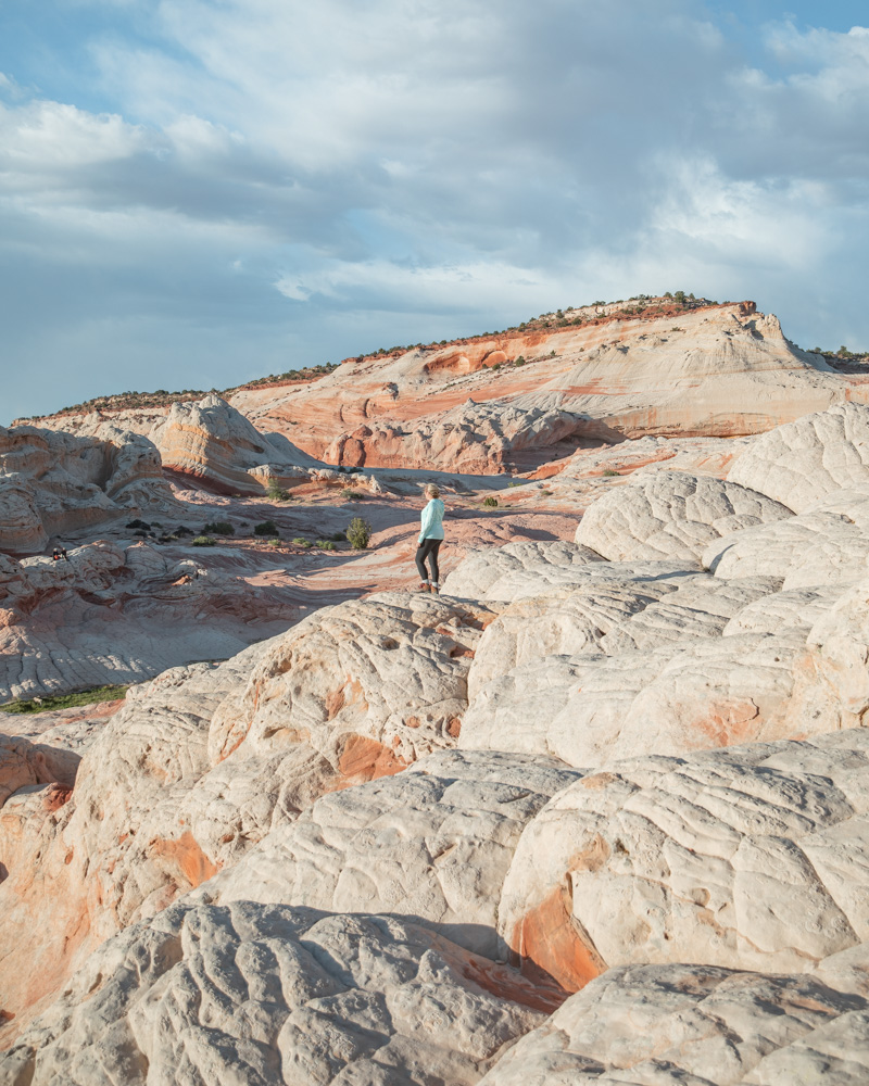 woman overlooking the white pocket geology