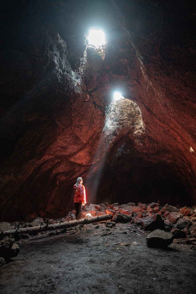woman in skylight cave in central oregon