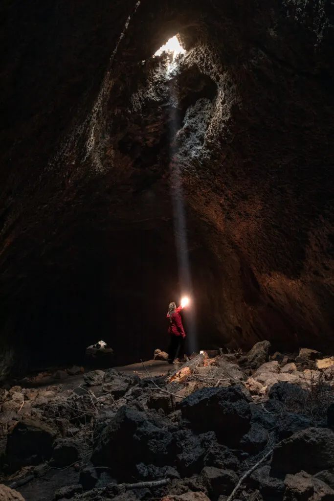 woman in skylight cave in sisters oregon