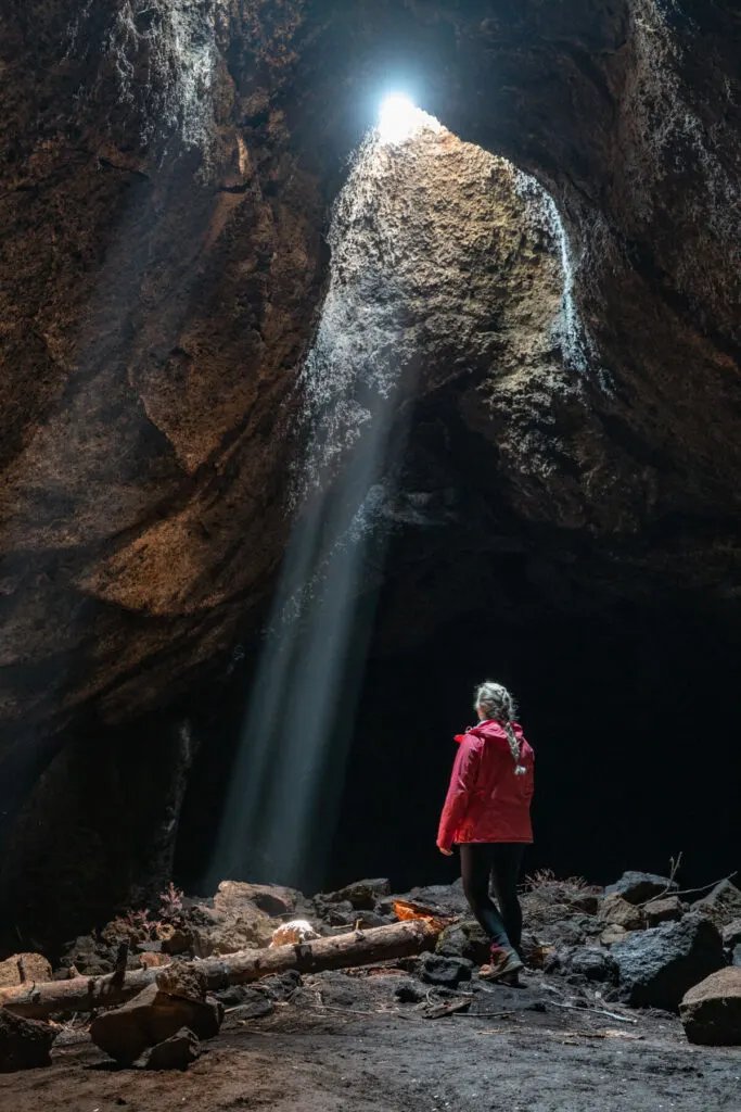 woman in skylight cave near bend oregon