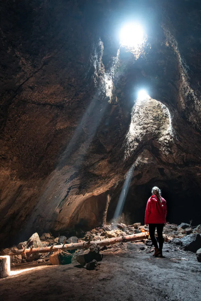 woman in skylight cave on a sunny day
