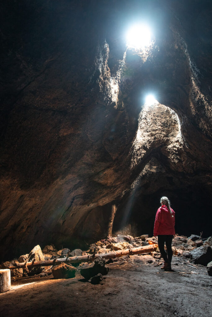 woman in skylight cave on a cloudy day