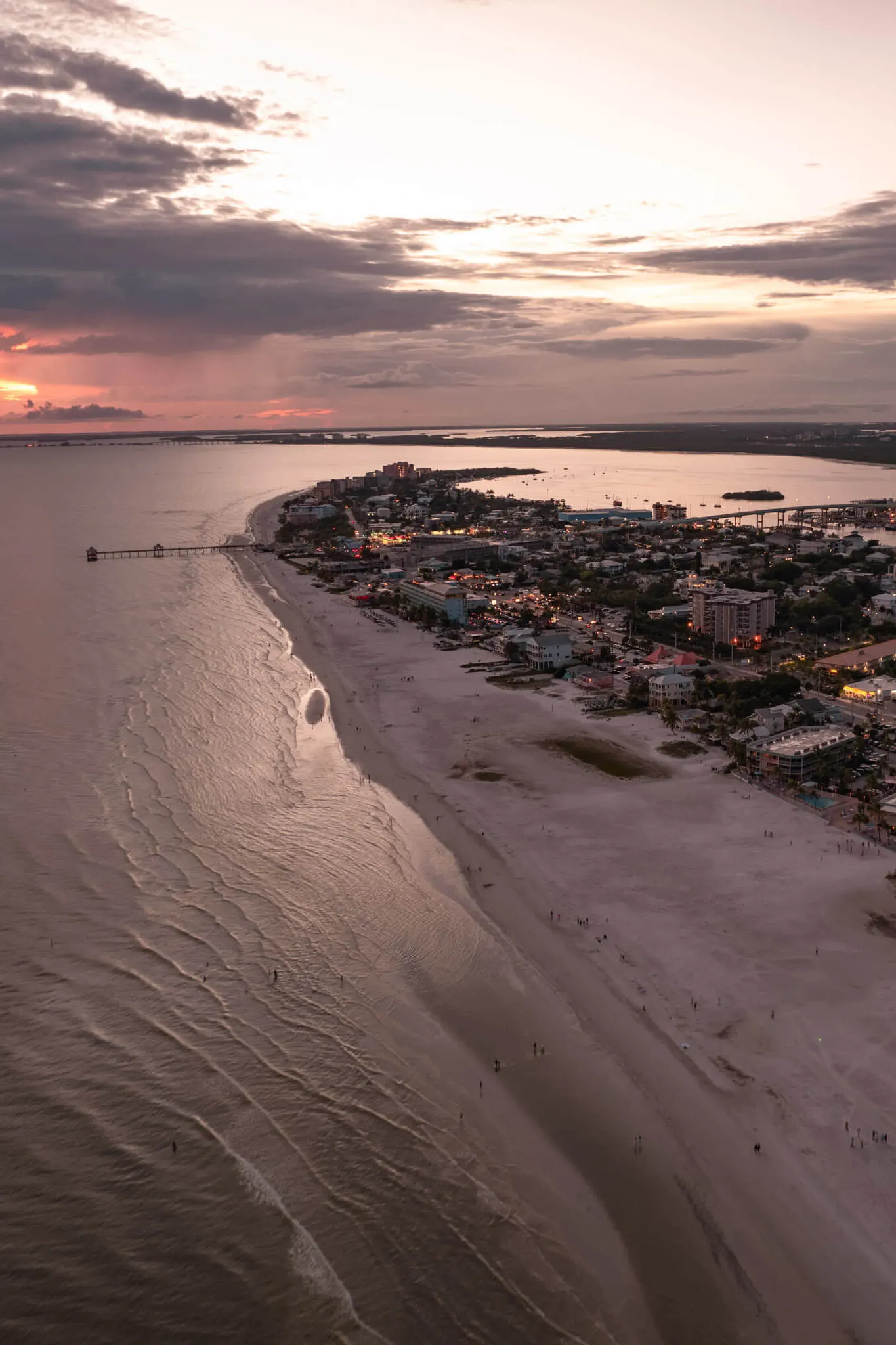 drone shot of fort myers beach at sunset