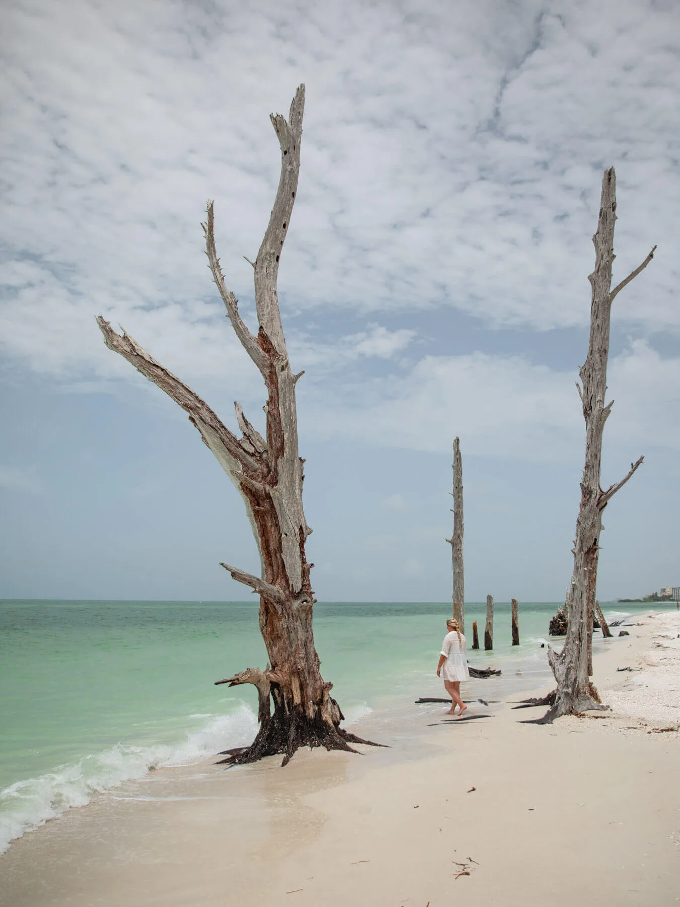 woman walking on lovers key beach, one of the best things to do in fort myers beach