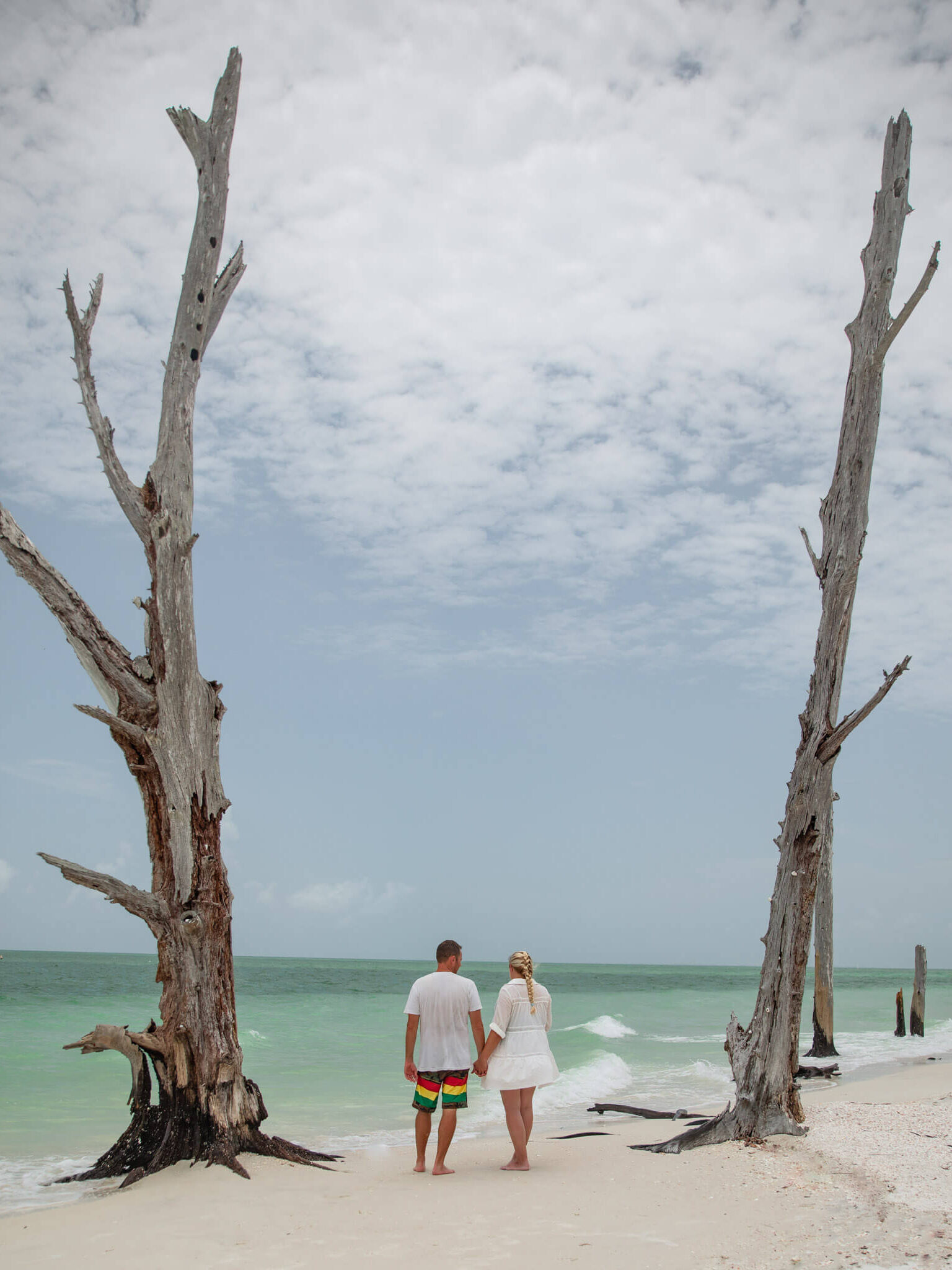 couple walking on lovers key beach, one of the best beaches in fort myers