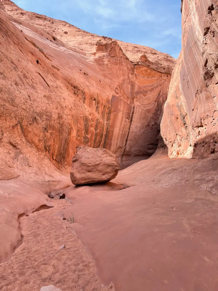 large boulder in the mouth of leprechaun canyon utah