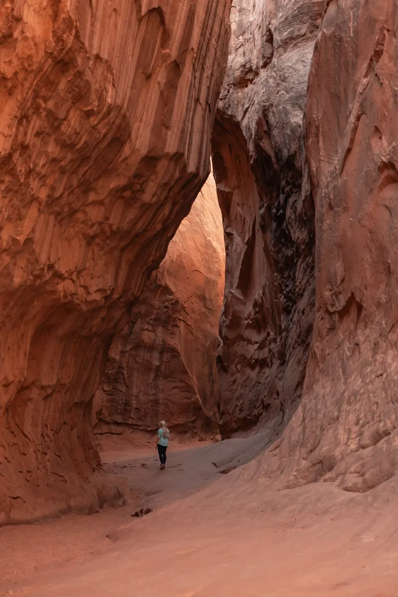 woman hiking in leprechaun canyon utah