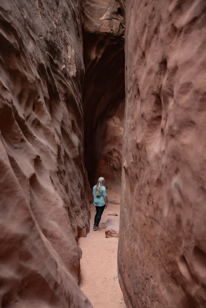 woman in narrow section of leprechaun canyon