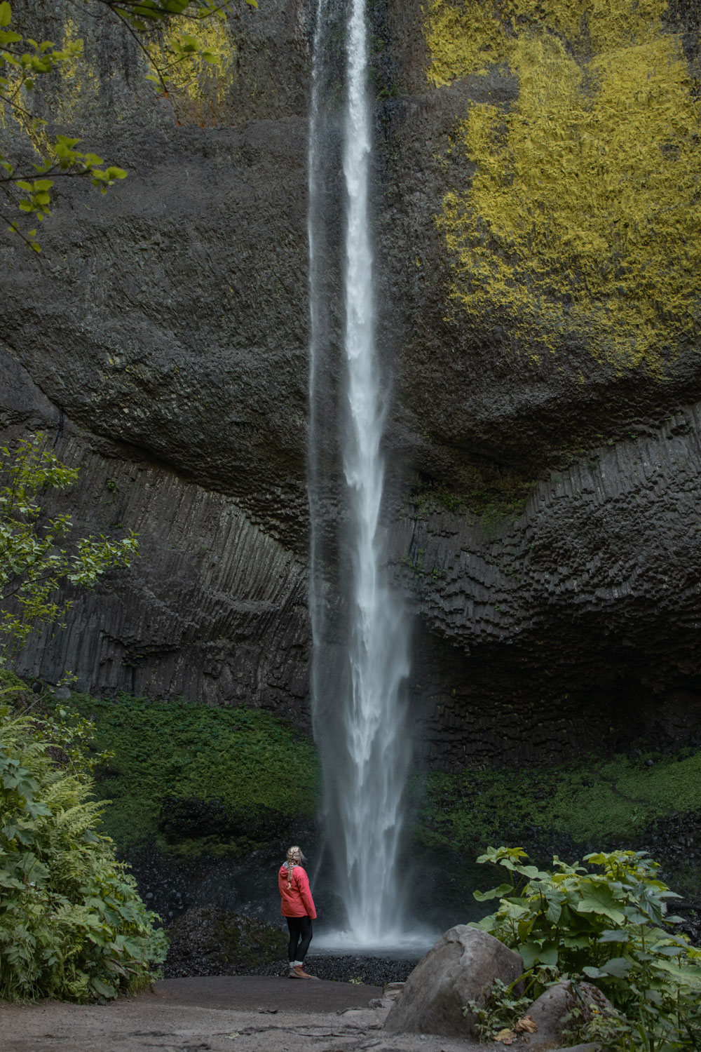 woman in front of Latourell Falls, one of the prettiest columbia river gorge waterfalls