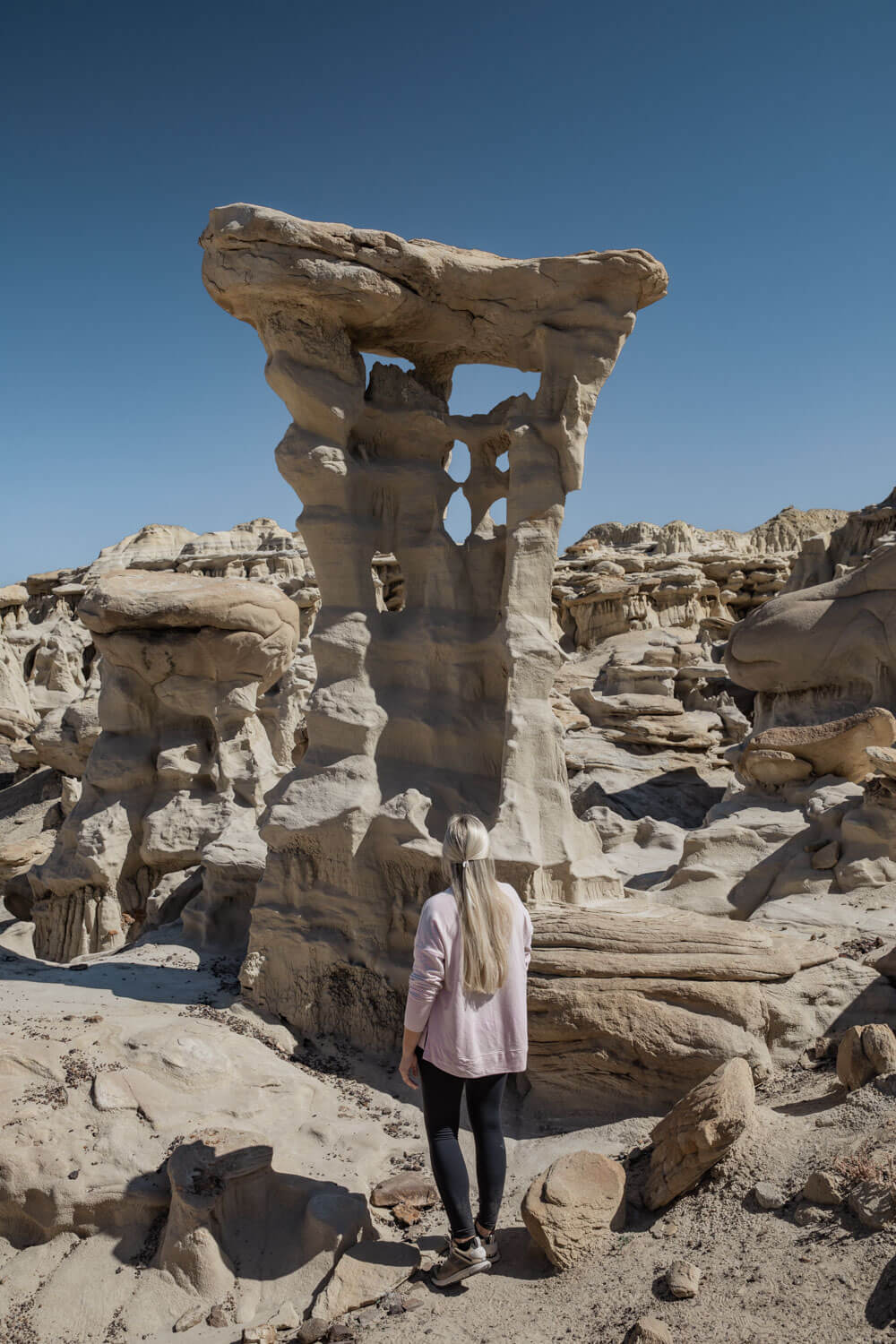 woman in front of Alien Throne in Valley of Dreams New Mexico