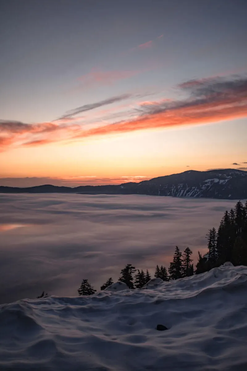 sunrise and fog on crater lake in may