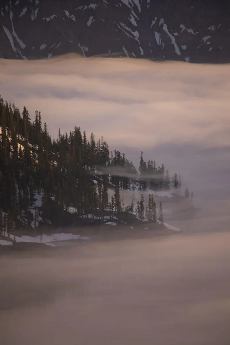 fog moving onto wizard island in crater lake