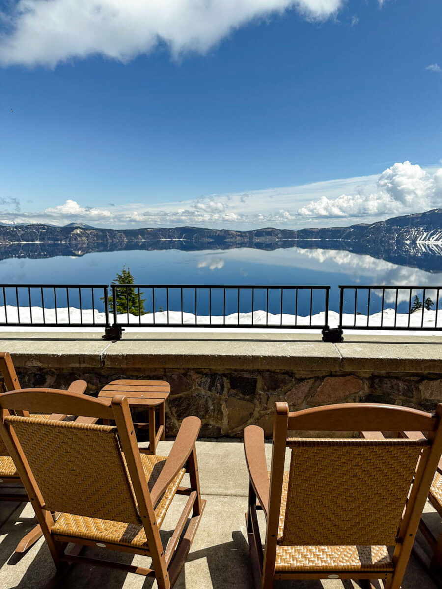 rocking chairs on the patio at crater lake lodge looking over the lake