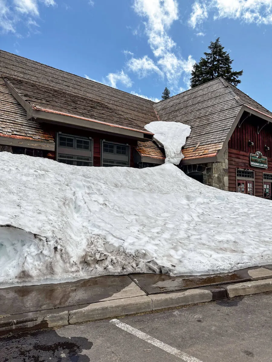 snow piled up against annie creek restaurant in crater lake national park
