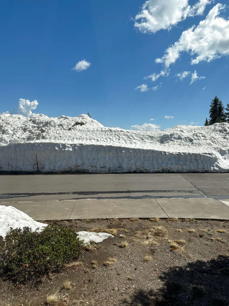 pile of snow in the parking lot at crater lake lodge